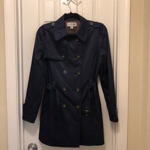 Navy blue trench coat with brown buttons
